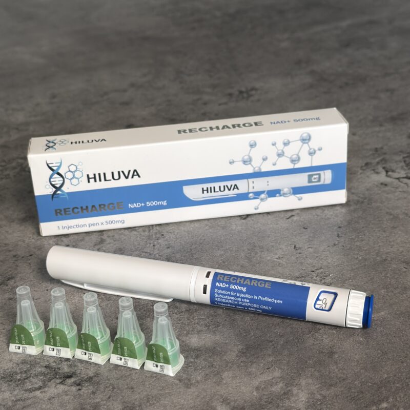 Hiluva recharge kit with a white pen-like applicator, a blue-and-white box, and five green ampoules on a gray surface.